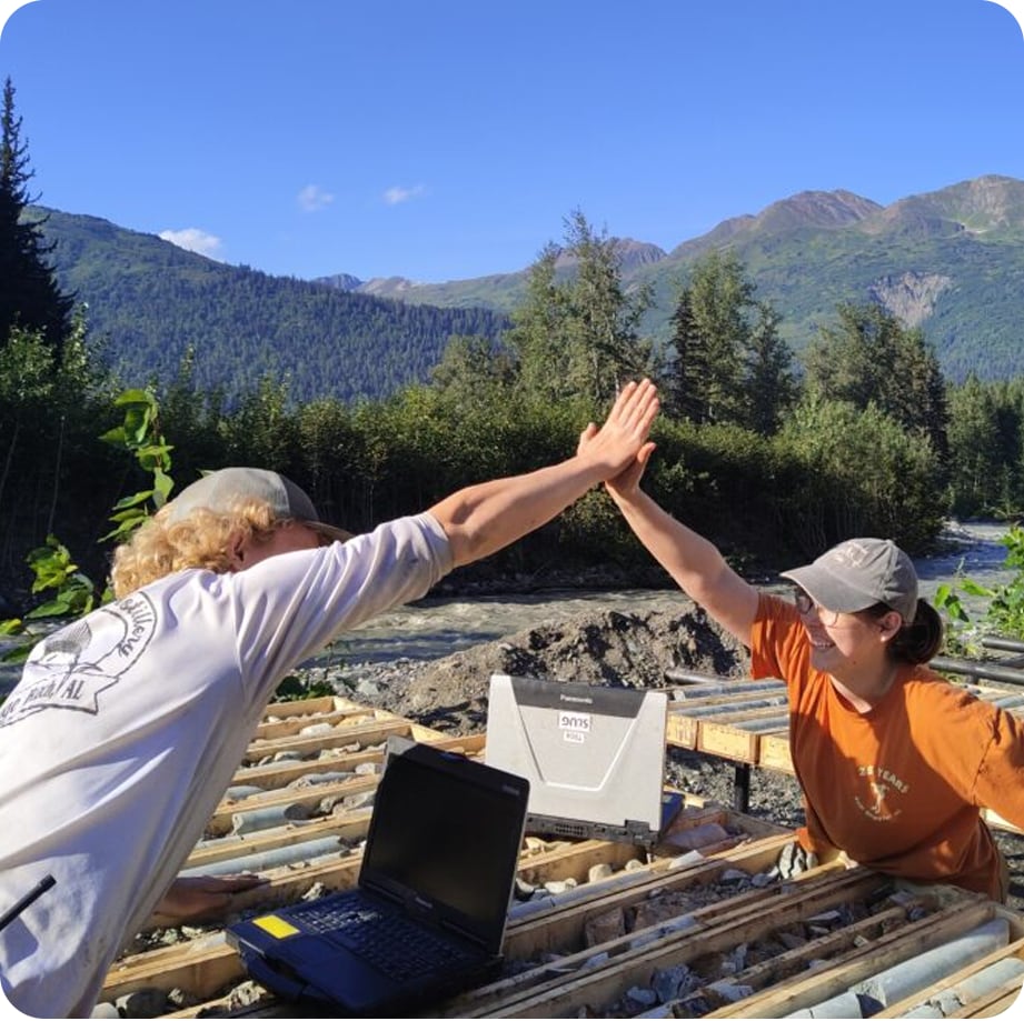 2 people high fiving