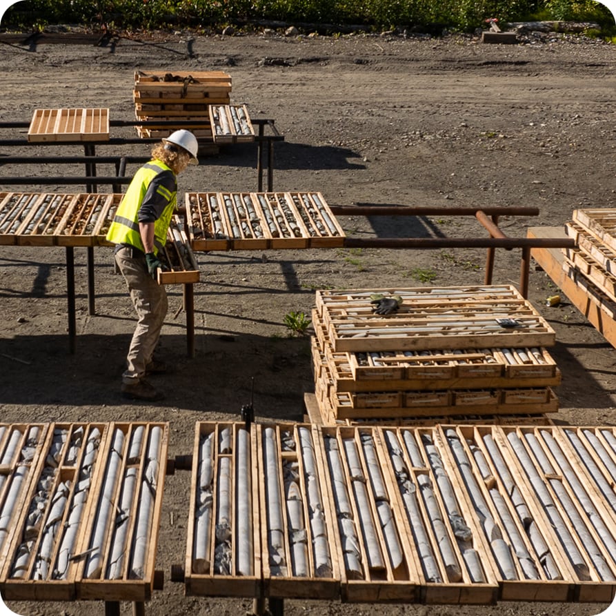 Worker handling ore samples
